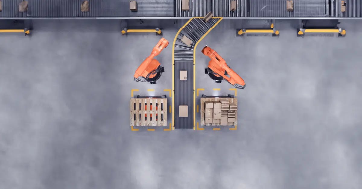Overhead view of a streamlined manufacturing floor with automated robotic arms, demonstrating essential Lean management tools in action for efficiency