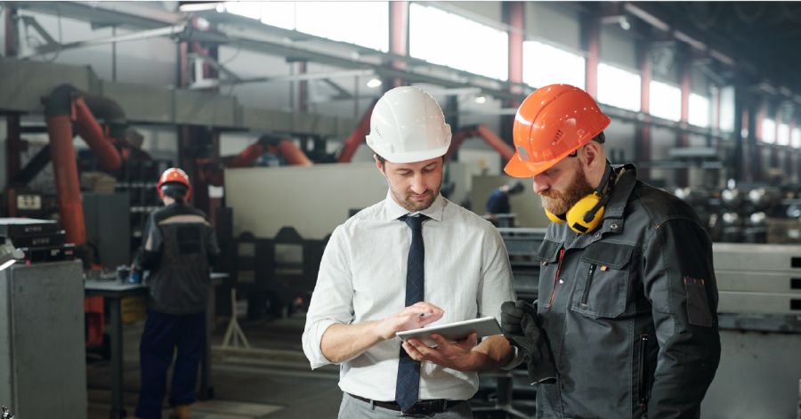 Two staff members doing a quality check in a factory - learn about Quality Trends in Manufacturing with Ease